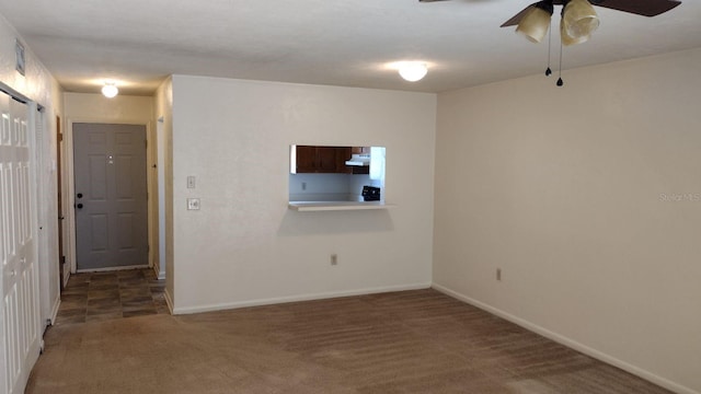 carpeted empty room with ceiling fan