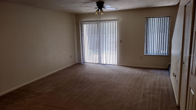 carpeted empty room featuring a textured ceiling and ceiling fan