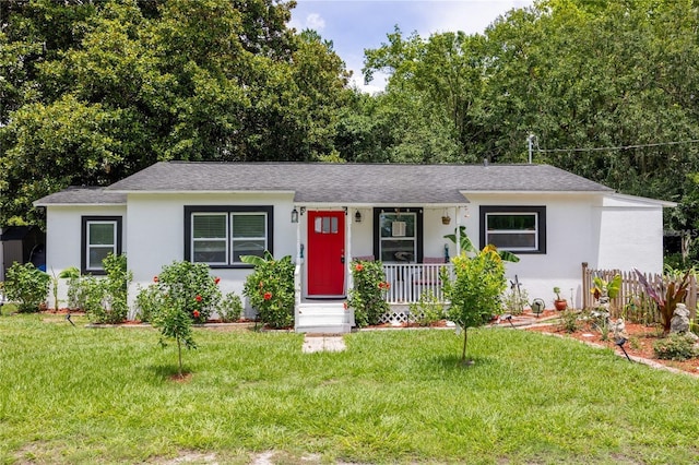 ranch-style home with a front yard and a porch