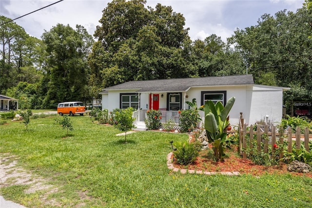 ranch-style house with a front lawn and a porch