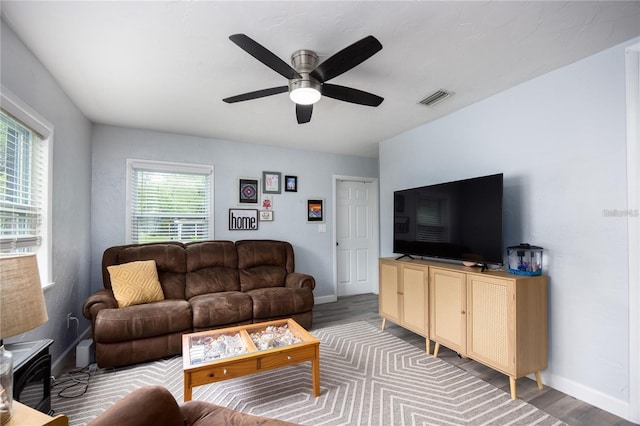 living room with ceiling fan, a wealth of natural light, and hardwood / wood-style floors