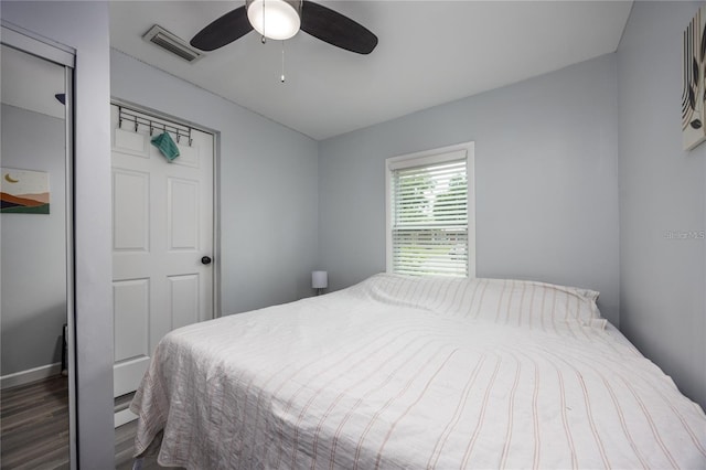 bedroom featuring ceiling fan and dark hardwood / wood-style floors