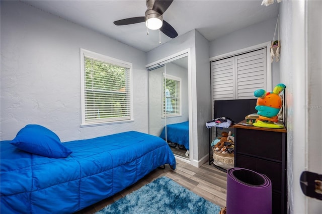 bedroom featuring a closet, hardwood / wood-style flooring, and ceiling fan