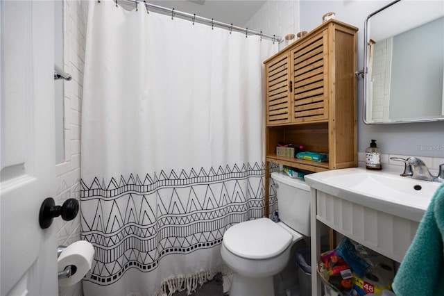 bathroom featuring toilet and walk in shower