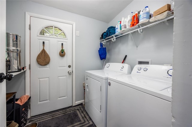 clothes washing area with washing machine and dryer