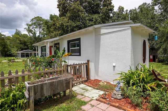 rear view of property with a yard