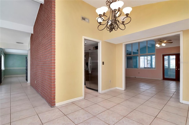 unfurnished dining area with vaulted ceiling with beams, ceiling fan with notable chandelier, and light tile patterned floors