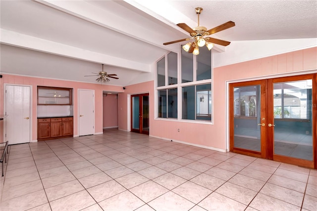 unfurnished living room featuring french doors, lofted ceiling with beams, a textured ceiling, light tile patterned floors, and ceiling fan