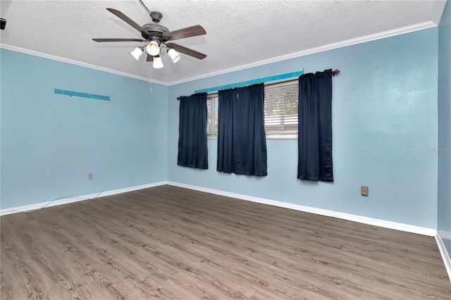 empty room featuring hardwood / wood-style flooring, ceiling fan, crown molding, and a textured ceiling