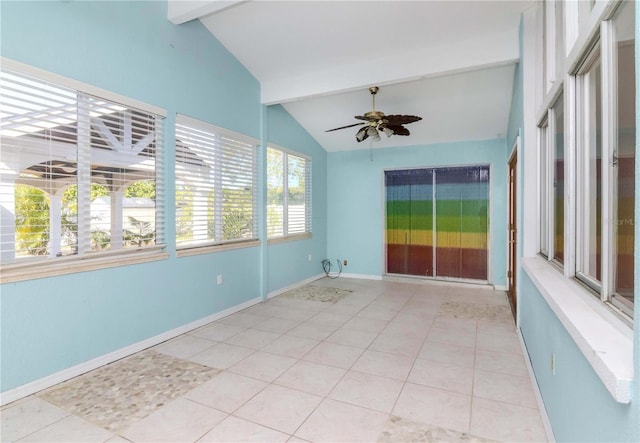 tiled empty room with lofted ceiling with beams and ceiling fan