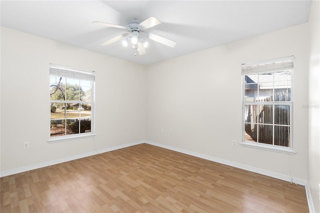 unfurnished room featuring hardwood / wood-style flooring and ceiling fan