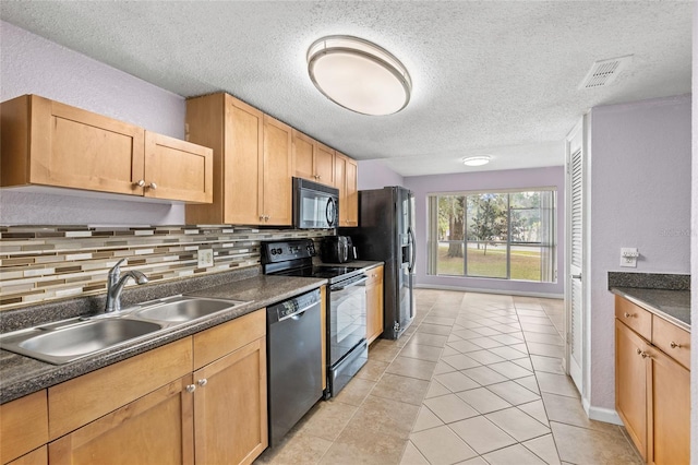 kitchen featuring backsplash, black appliances, sink, light brown cabinets, and light tile patterned floors