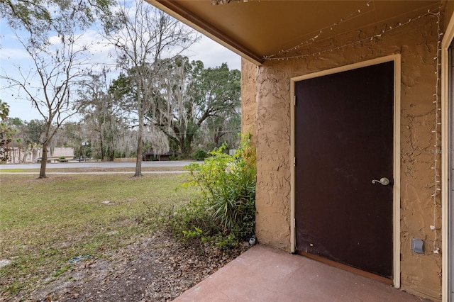 1810 NW 23rd Blvd Unit 202, Gainesville, FL 32605 - doorway to property with a yard