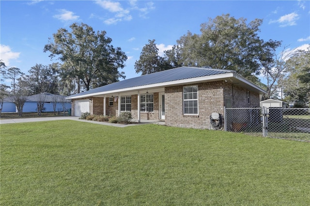 ranch-style house featuring a garage, a front lawn, and a porch