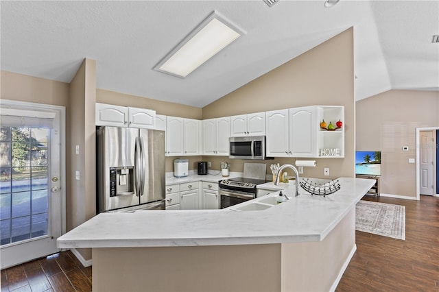 kitchen featuring dark hardwood / wood-style flooring, sink, stainless steel appliances, and white cabinetry