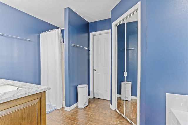 bathroom with vanity and curtained shower