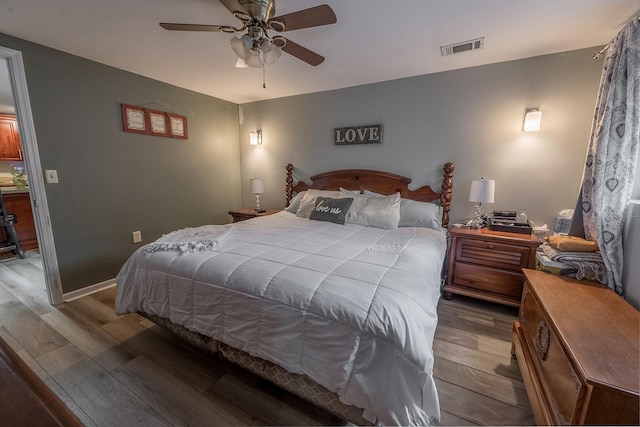 bedroom with ceiling fan and hardwood / wood-style flooring