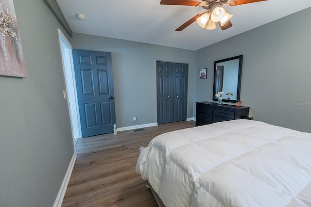 bedroom featuring a closet, hardwood / wood-style floors, and ceiling fan