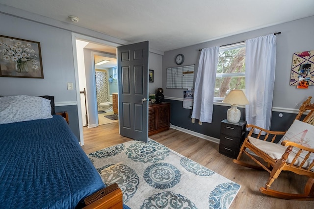 bedroom with light hardwood / wood-style flooring