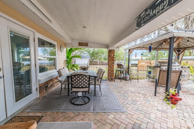 view of patio featuring a grill