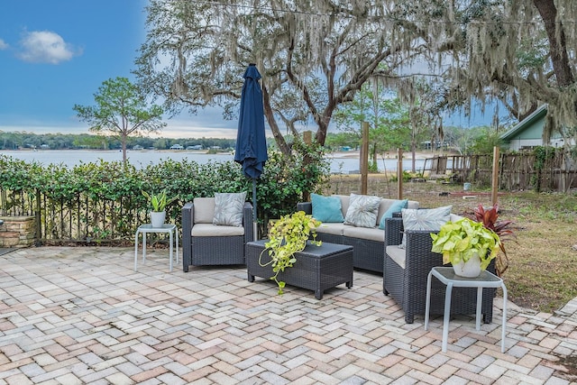 view of patio / terrace with an outdoor hangout area and a water view