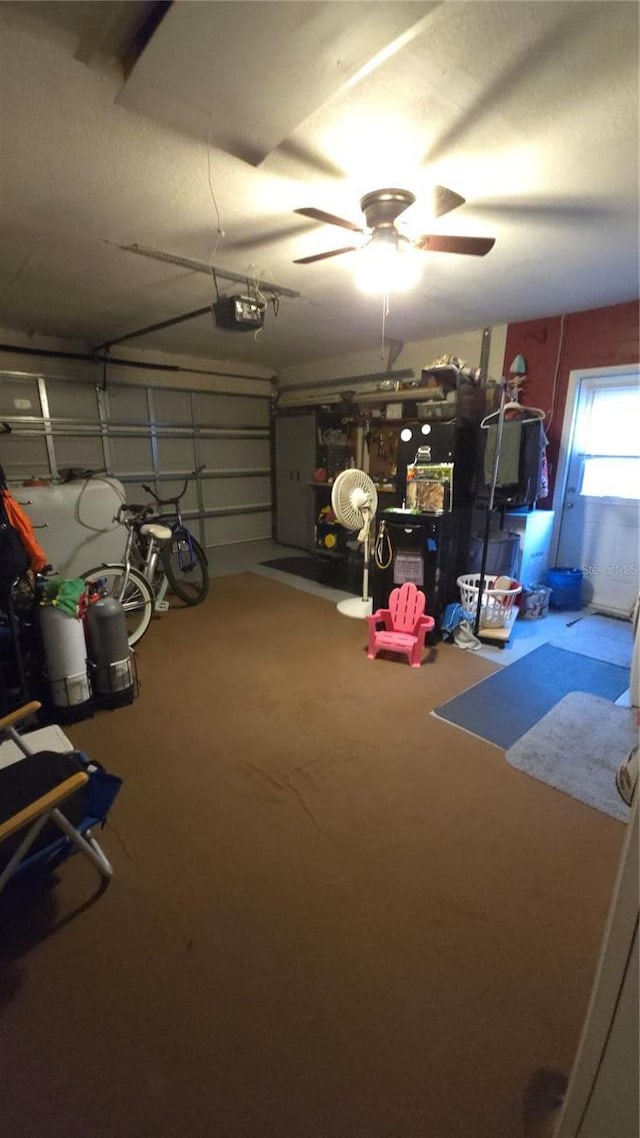 garage featuring a garage door opener and ceiling fan