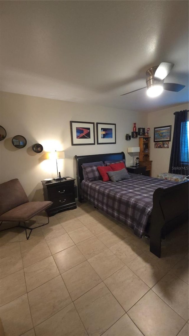 bedroom featuring light tile patterned flooring and ceiling fan