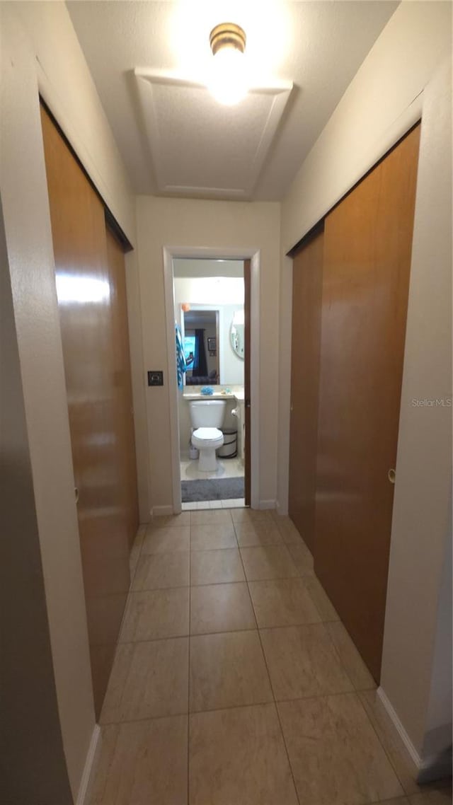 hallway with light tile patterned flooring