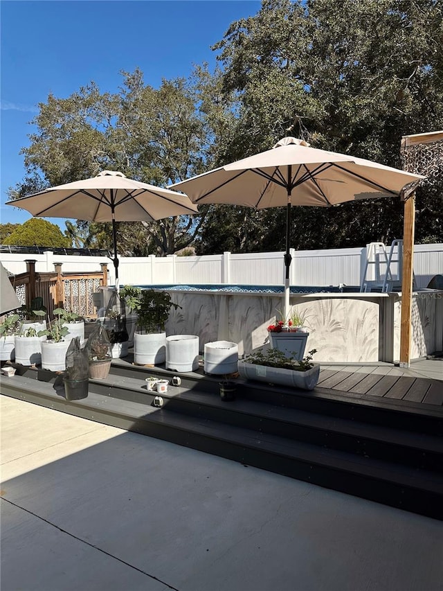 view of patio featuring an empty pool