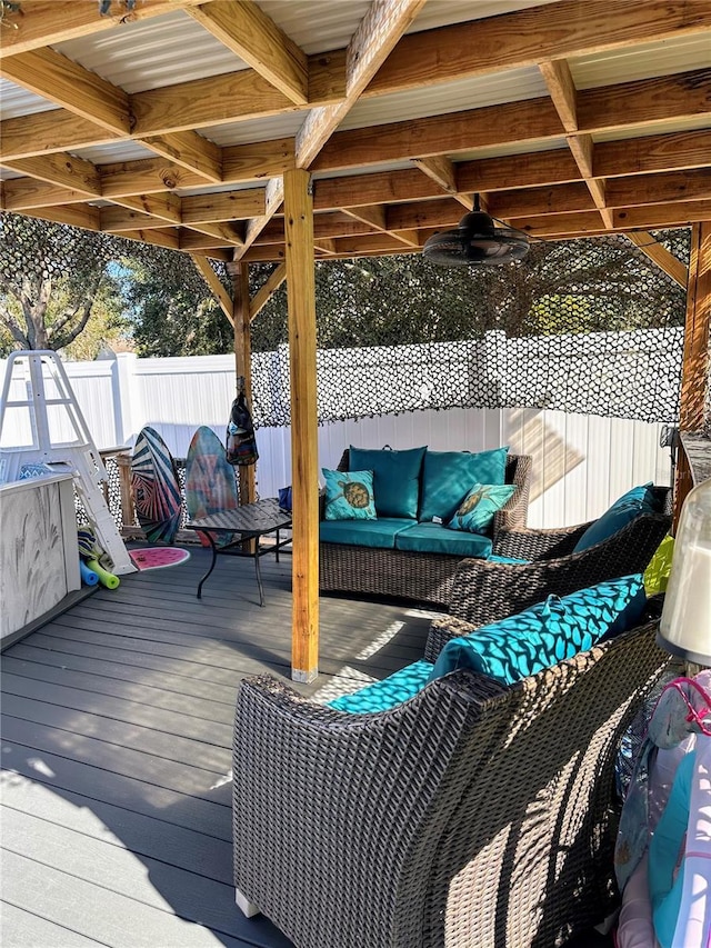 deck featuring ceiling fan and outdoor lounge area