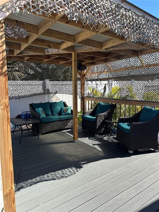 wooden terrace featuring an outdoor hangout area