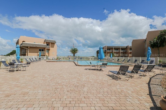 view of swimming pool with a patio area