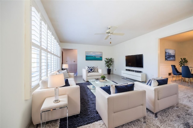 living room with hardwood / wood-style flooring and ceiling fan