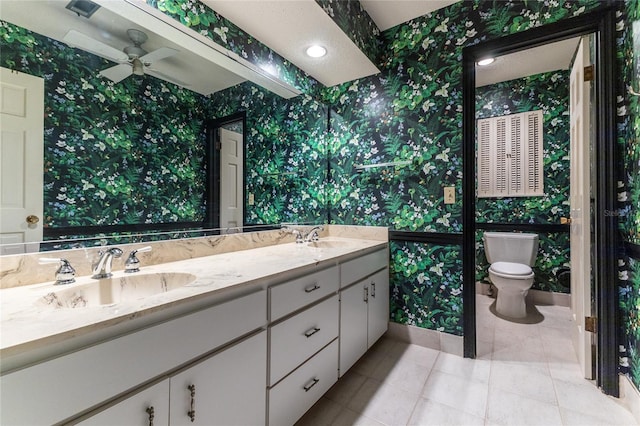 bathroom with ceiling fan, vanity, and toilet