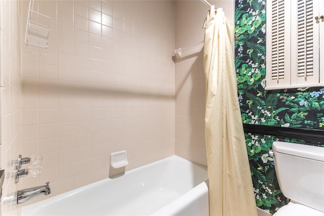 bathroom featuring shower / bathtub combination with curtain and toilet