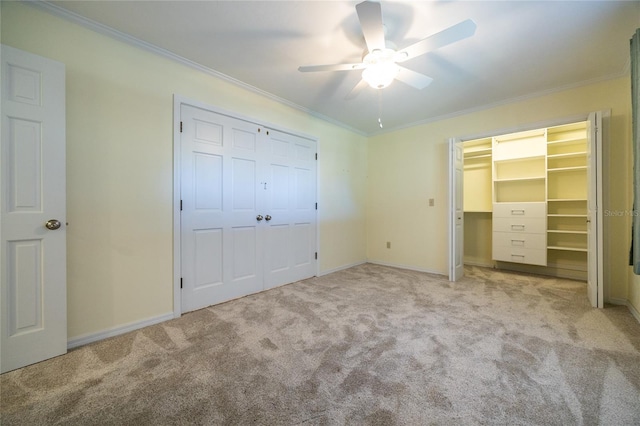 unfurnished bedroom with light carpet, crown molding, and ceiling fan