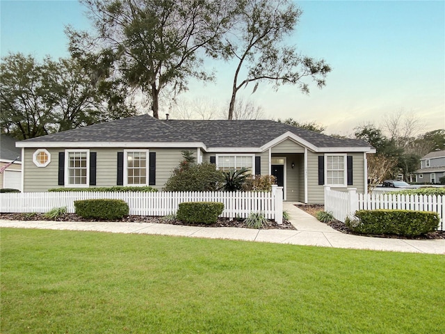 ranch-style house with a yard