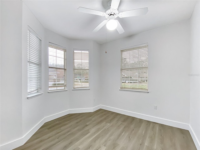 unfurnished room featuring ceiling fan and light hardwood / wood-style flooring