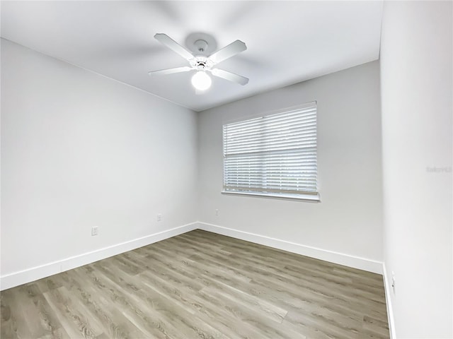 spare room featuring ceiling fan and wood-type flooring