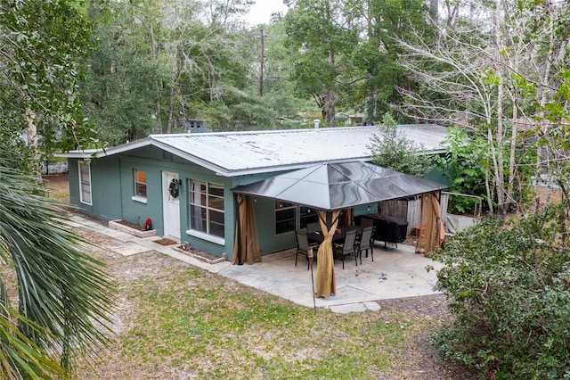 back of property featuring a patio