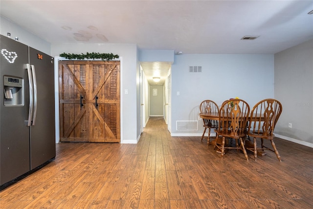 dining area featuring wood-type flooring