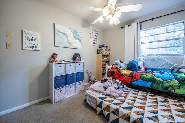 bedroom featuring ceiling fan and carpet