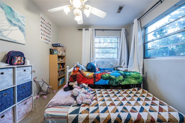 carpeted bedroom featuring ceiling fan