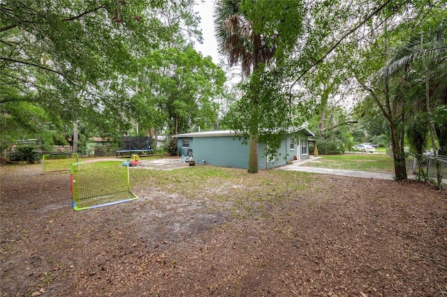 view of yard with a trampoline