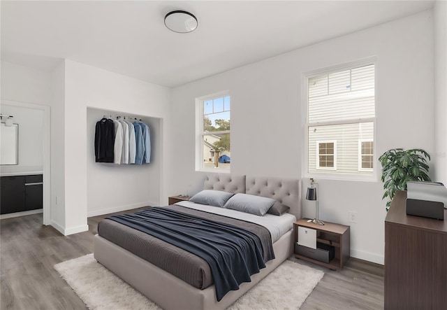 bedroom with hardwood / wood-style floors