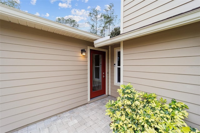 property entrance featuring a patio