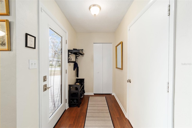 hall with dark hardwood / wood-style floors