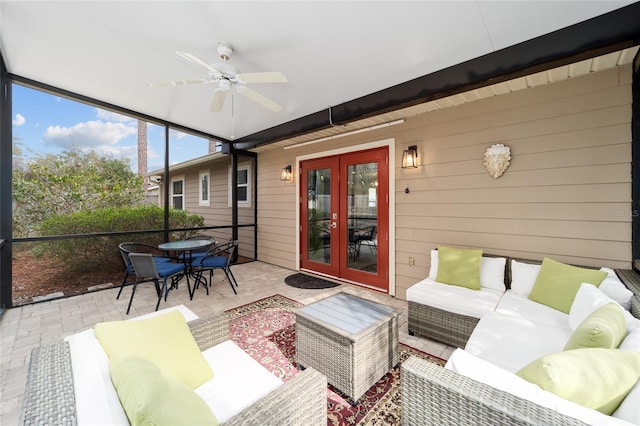 sunroom featuring ceiling fan