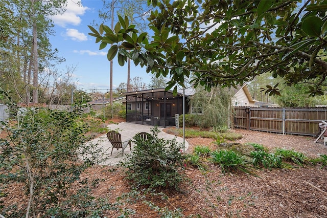 view of yard with a patio and a sunroom