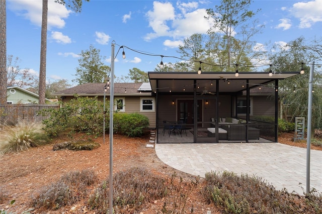 back of house with an outdoor hangout area and a patio